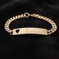 Gold Speidel bracelet with nameplate and heart cutout on black background